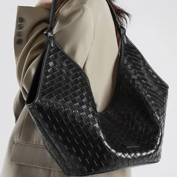 Black luxury hobo purse with woven texture and modern elegance