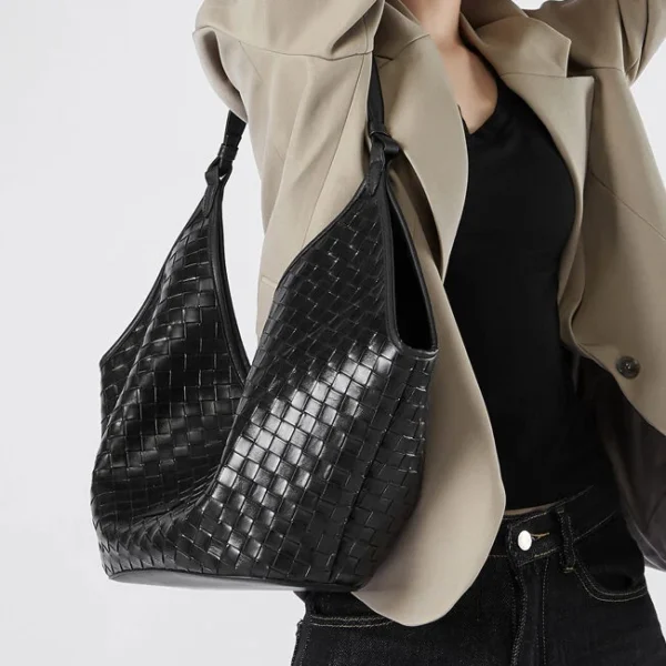 Slouchy black leather hobo handbag with versatile crossbody strap