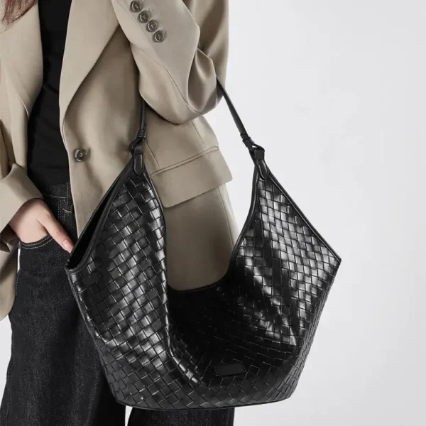 Designer black hobo handbag with palladium hardware and crescent silhouette