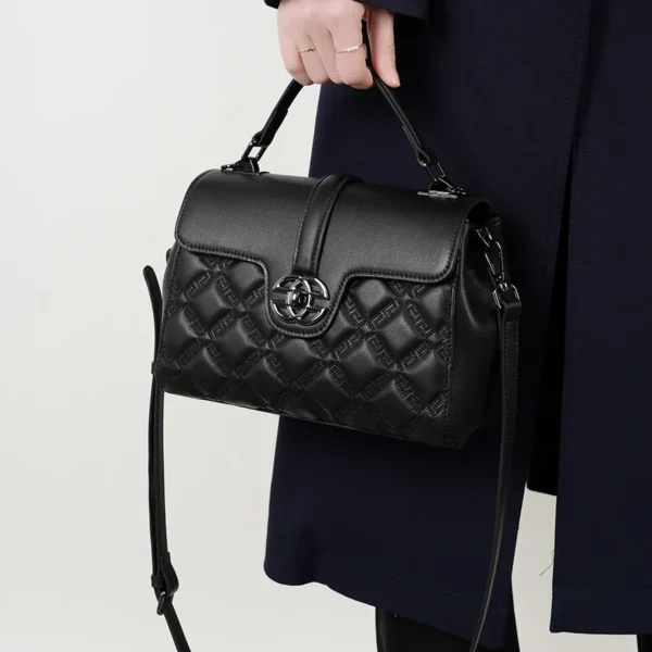 Black crossbody satchel bag, soft leather, modern design for daily carry