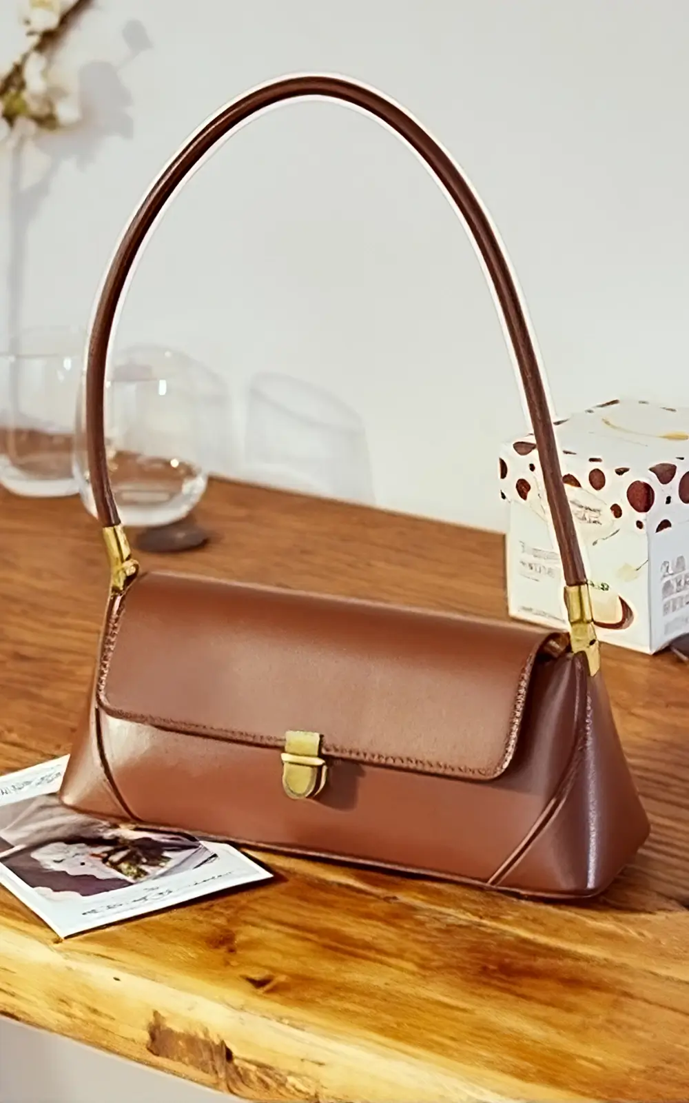 Elegant brown baguette-style handbag with premium craftsmanship