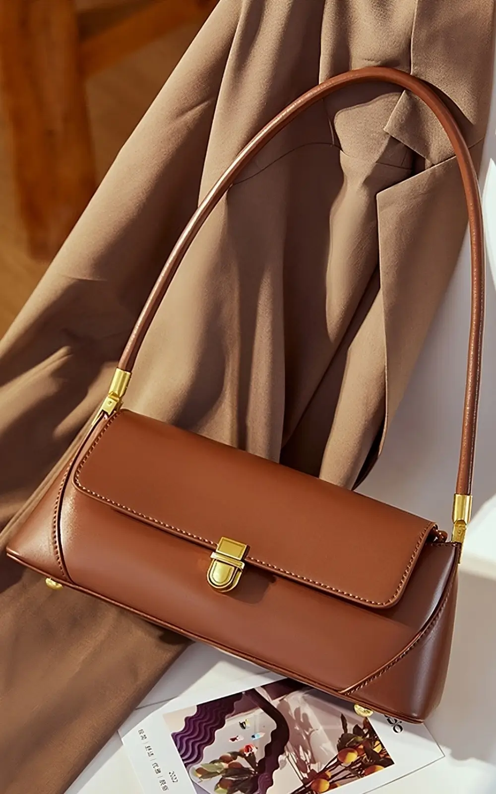 Structured brown leather purse with top handle and crossbody option