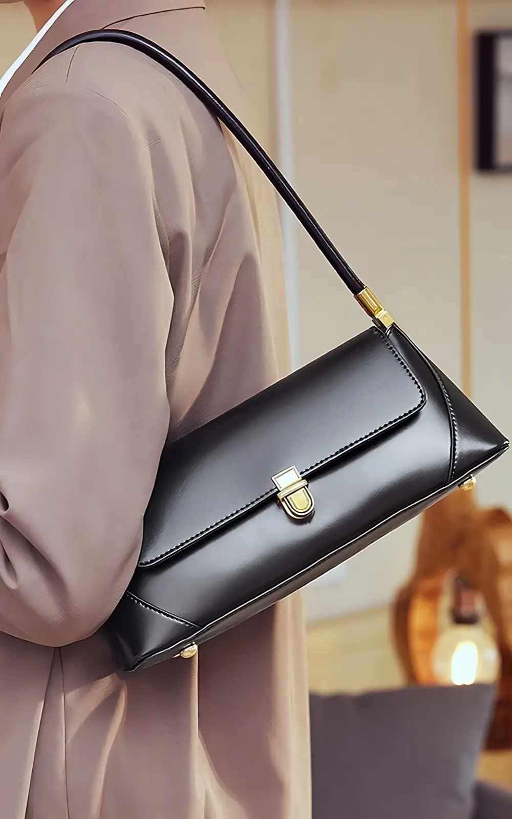 Classic black shoulder baguette bag with flap closure