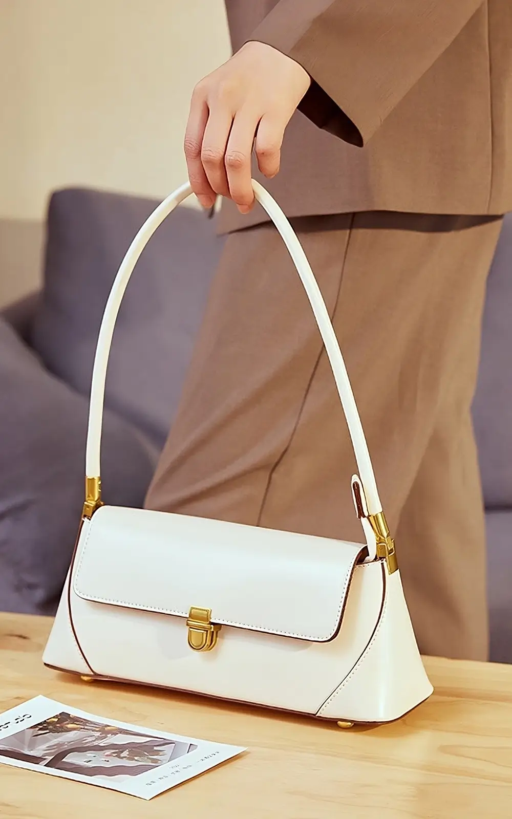 Elegant white leather baguette purse for women with versatile styling
