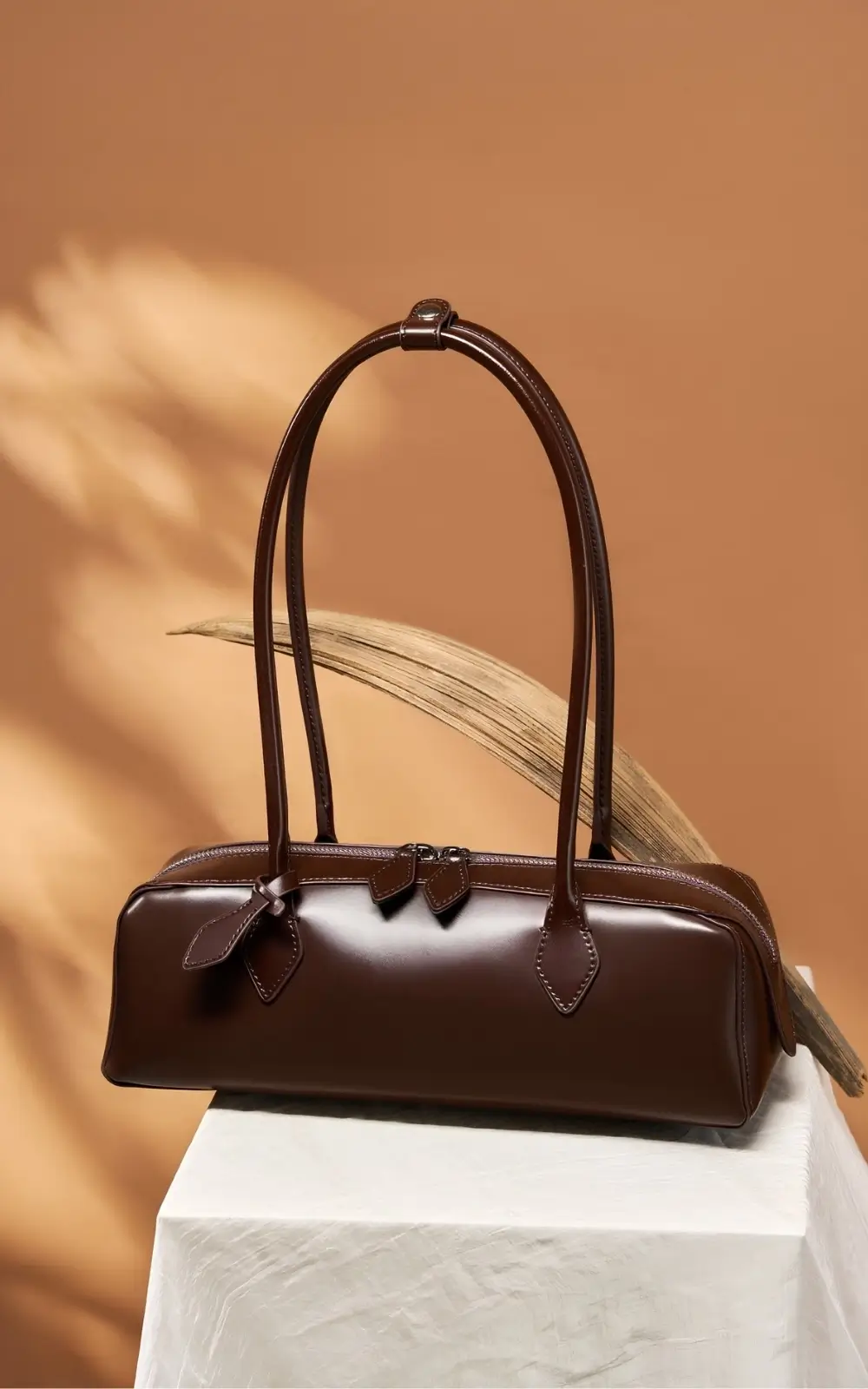 Slim leather baguette bag with twin handles – premium fashion accessory