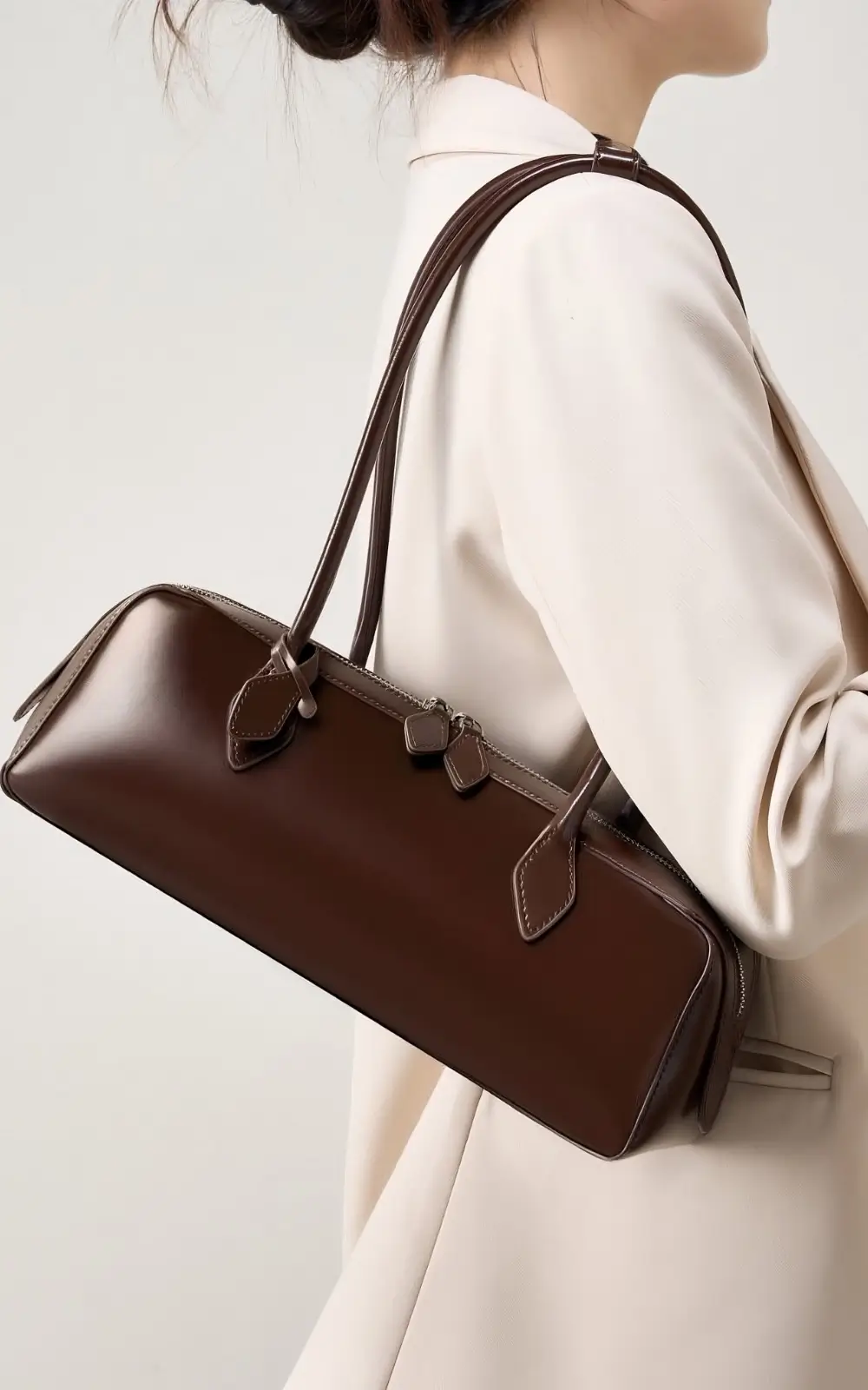 Brown leather baguette bag with elongated silhouette – made in France