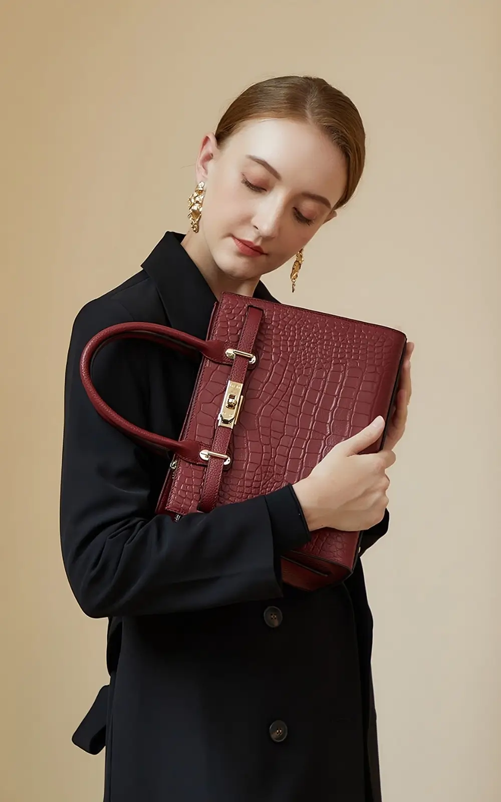 Red Italian leather satchel bag with structured silhouette
