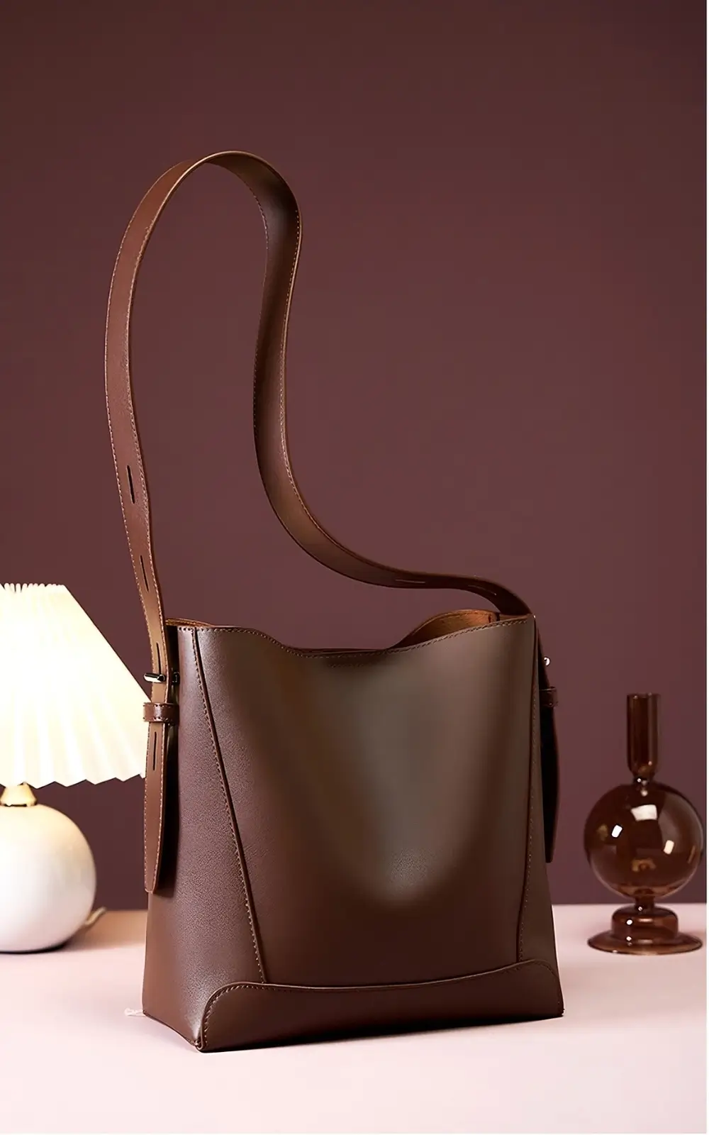 Lunaro Bucket calfskin leather bag in beige with top handle and gold hardware