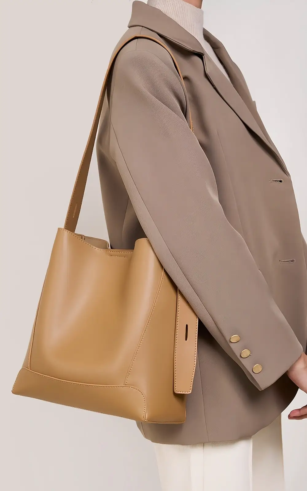 Light brown Lunaro Bucket styled with casual outfit on city street