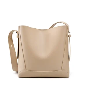 Lunaro Bucket bag in beige calfskin leather with top handle and brushed gold hardware, front view on neutral background