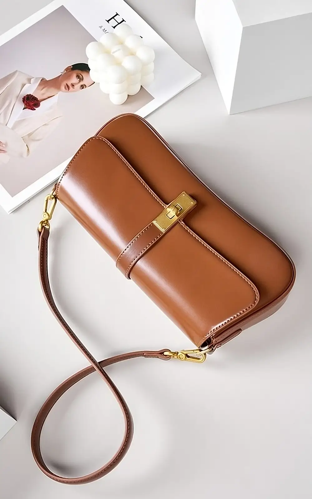 Model wearing brown Marisse Baguette Bag on shoulder for casual premium look