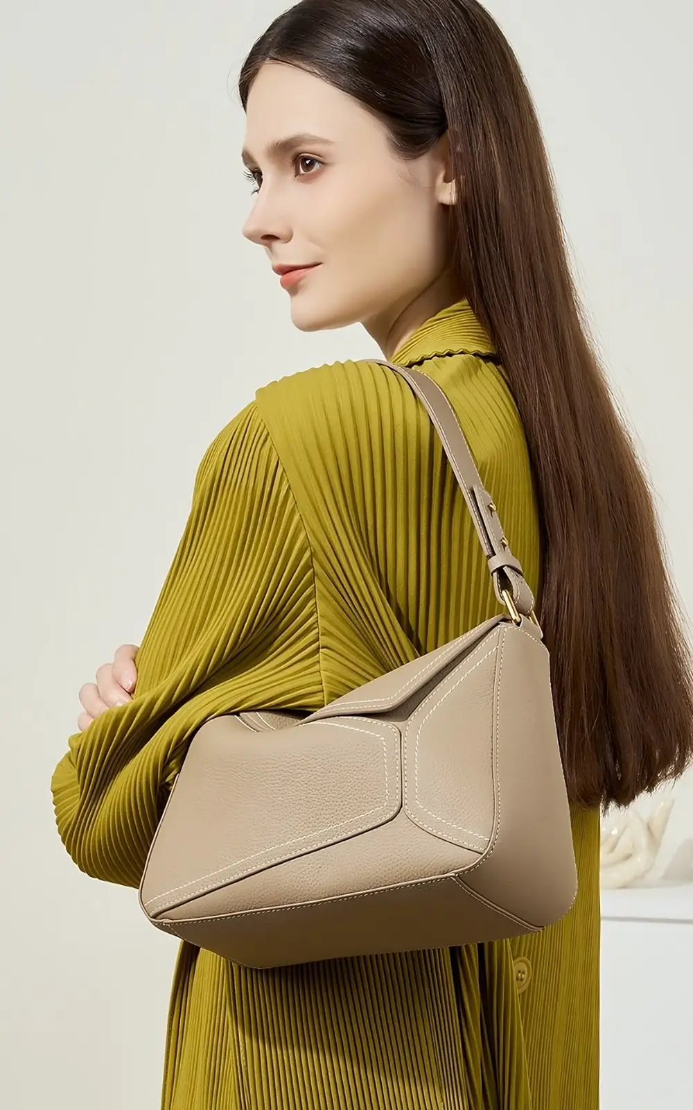 Gold-tone hardware and strap adjustment detail on Hoclin premium hobo bag