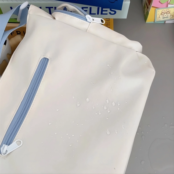 Cream large ita messenger bag with clear pin display window showing anime badges and butterfly charms