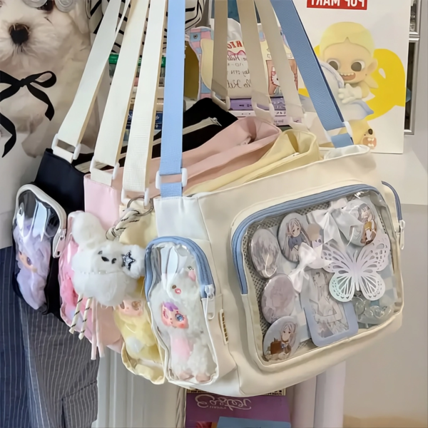 Large ita bag collection in cream, black, pink, yellow and blue colors with clear pin display window
