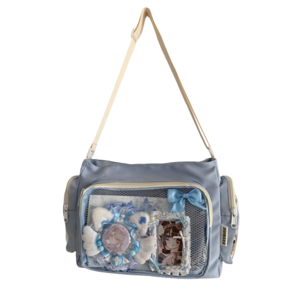 Pastel blue large ita bag crossbody with kawaii anime pins and charm display