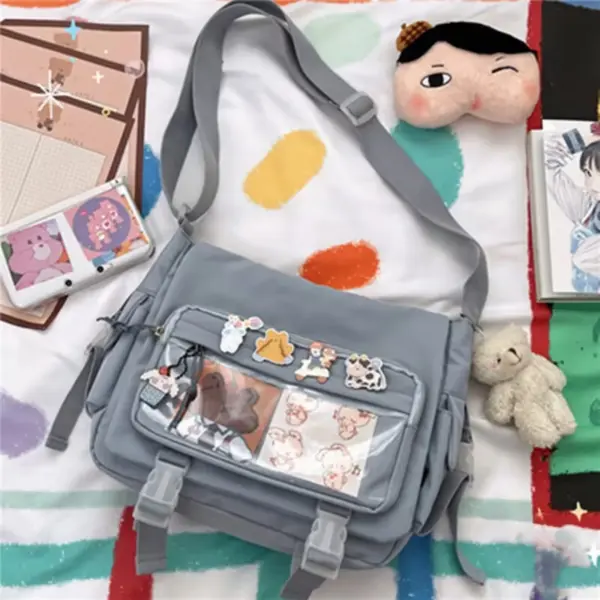 Blue ita bag filled with stickers and cards in clear window, on gray background