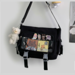 Close Up: Black Ita Bag with Plush Bear and Badges