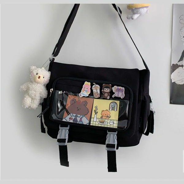 Close Up: Black Ita Bag with Plush Bear and Badges