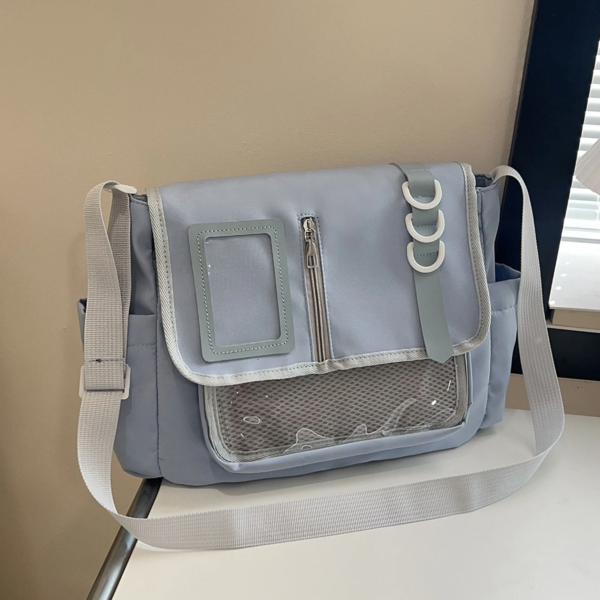 Flat Lay of CCC Ita Bag with Insert Board and Enamel Pins