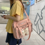 Lifestyle Shot: Pink Ita Bag Worn Crossbody | Hoclin