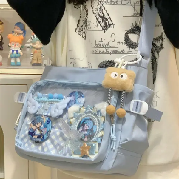 Light blue ita bag worn casually on hip, filled with blue anime badges and hanging charm