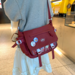 Maroon Ita Bag Worn Crossbody
