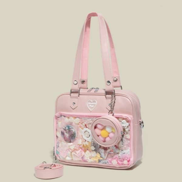 pink heart window ita bag with coin purse on white desk