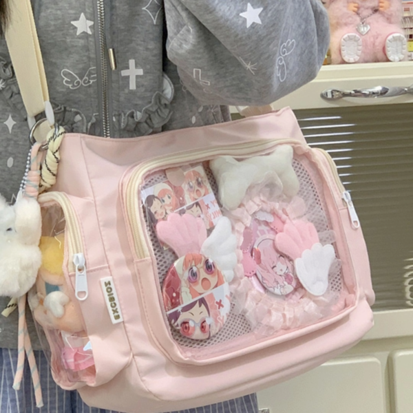 Side view of bag showing elastic pocket holding a 10cm doll
