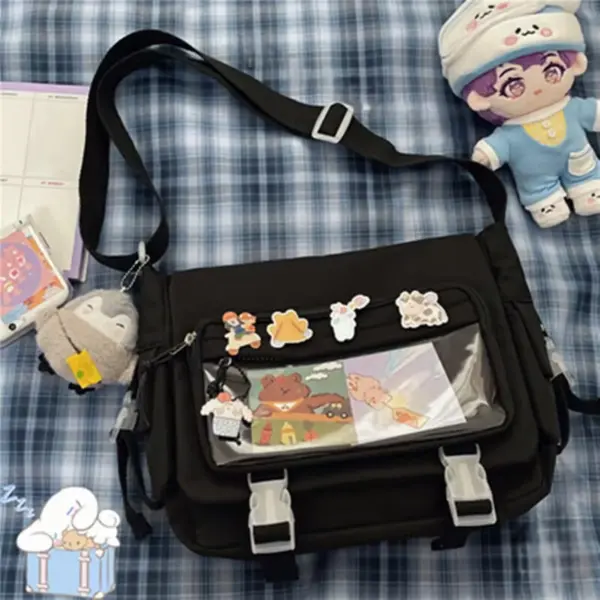 Side view of black ita bag showing depth and dense pin display in clear window