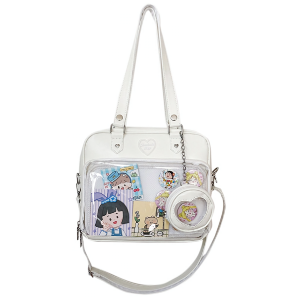 white heart window ita bag with matching coin purse on plain background showing clear front display and heart cutout