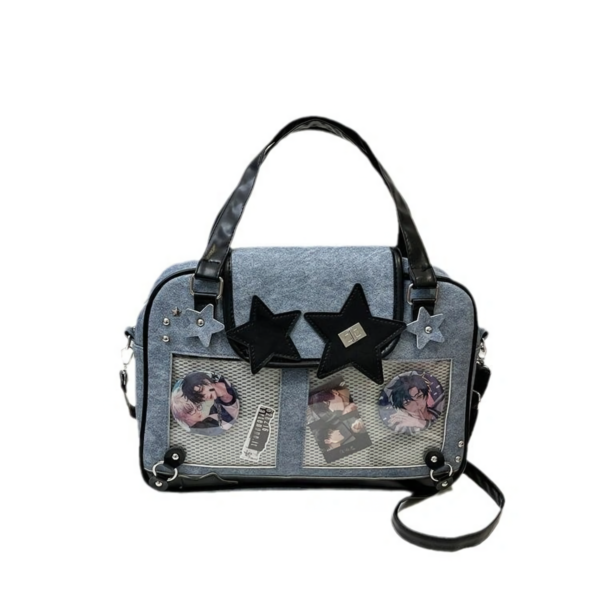 Side view of denim ita bag showing adjustable strap buckle and metal D-rings