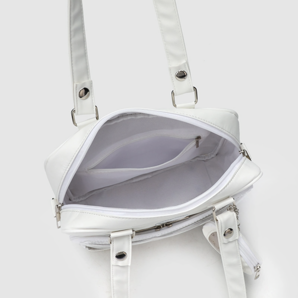 top down view of white ita bag open showing interior lining and separate compartments