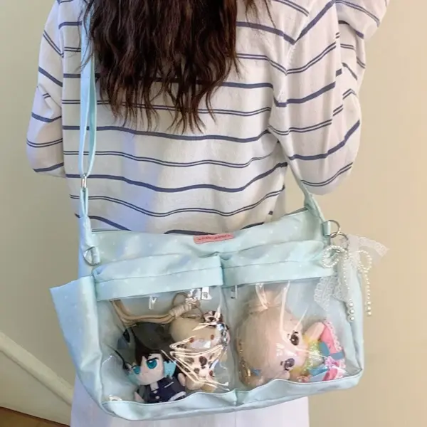 Side view of sky blue ita bag on person with striped shirt