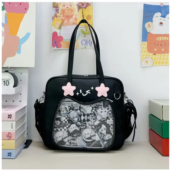 Black ita bag with pink stars on a desk next to colorful stationery