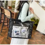 Black Ita Bag from Side with Plush Black Ita Bag from Side with Plush