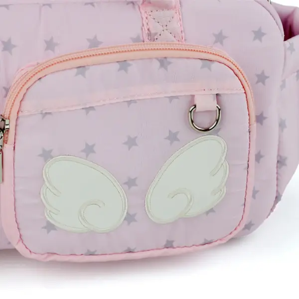 Close up of white fabric wing stitched on pink star ita bag