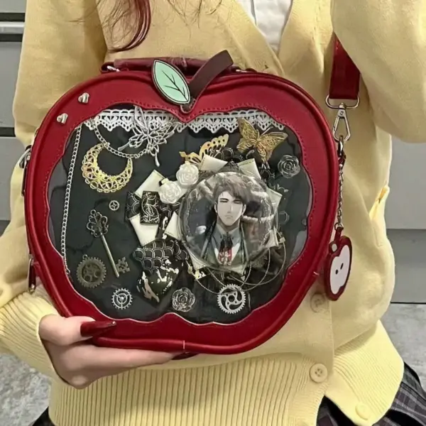 close up of red apple ita bag with vintage keys and lace inside