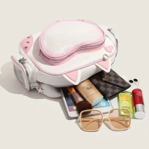 bag opened showing interior with plush and accessories