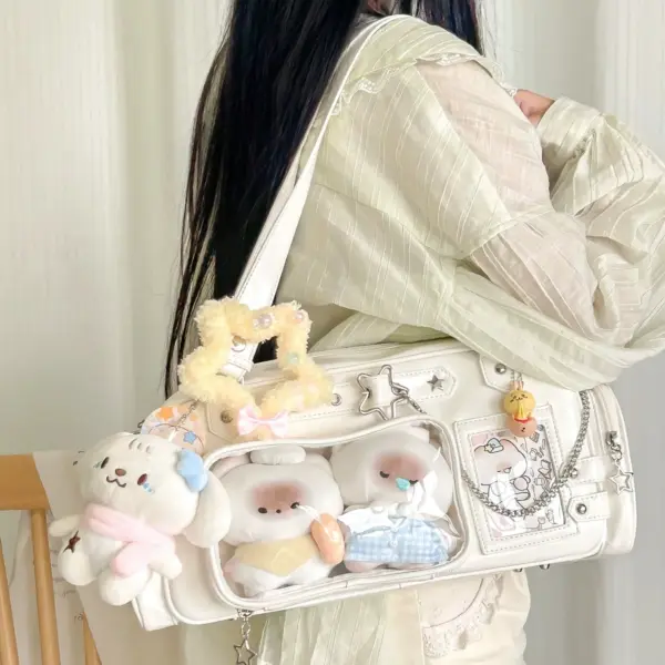 white ita bag for dolls with three plush anime characters attached to display window