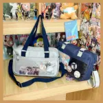 Gray and Navy Ita Bag Side by Side on Wooden Surface