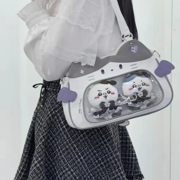 Close up of clear window ita bag with plush keychains inside