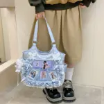 Light Blue Ita Bag Worn Over Shoulder
