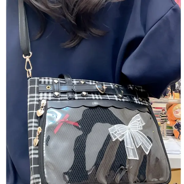 Close-up of ita bag strap connector and heart-shaped metal attachment