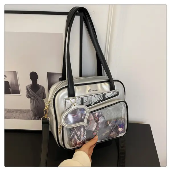 Ita bag worn as crossbody for conventions Person wearing crossbody ita bag at outdoor event