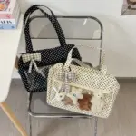 Ita Bags Resting on Transparent Chair