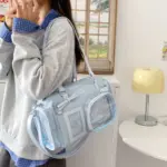 Light Blue Ita Bag Held by Person Light Blue Ita Bag Held by Person