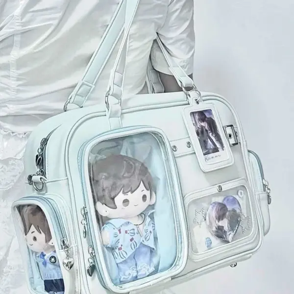 Light blue ita bag from side angle showing clear windows on front and sides