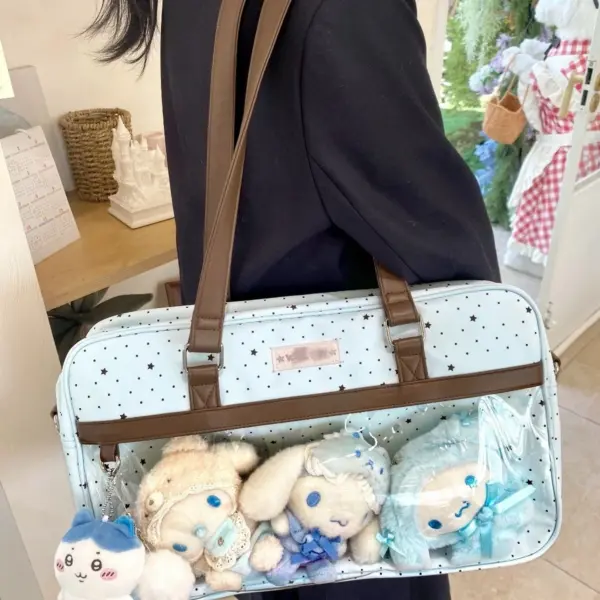 Light blue polka dot ita bag worn crossbody at a convention