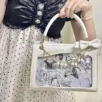Wearing the White Lily of the Valley Ita Bag Wearing the White Lily of the Valley Ita Bag