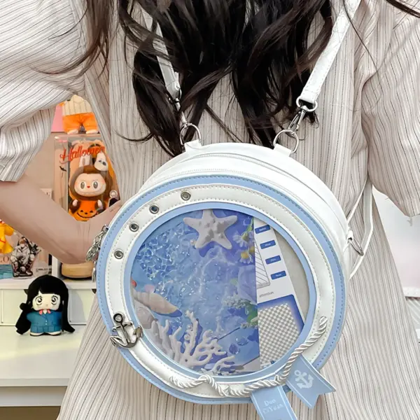 Round ita bag backpack on person showing transparent window with beach themed insert